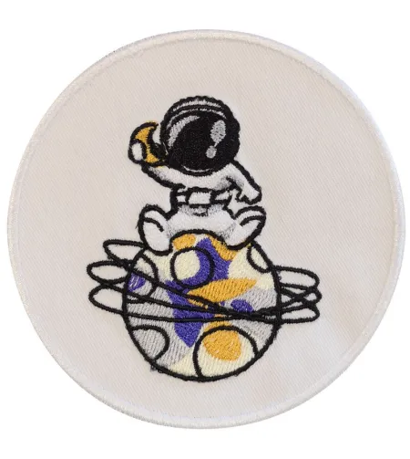 Emblema Fil Mécanique Astronautas sėdi planetoje